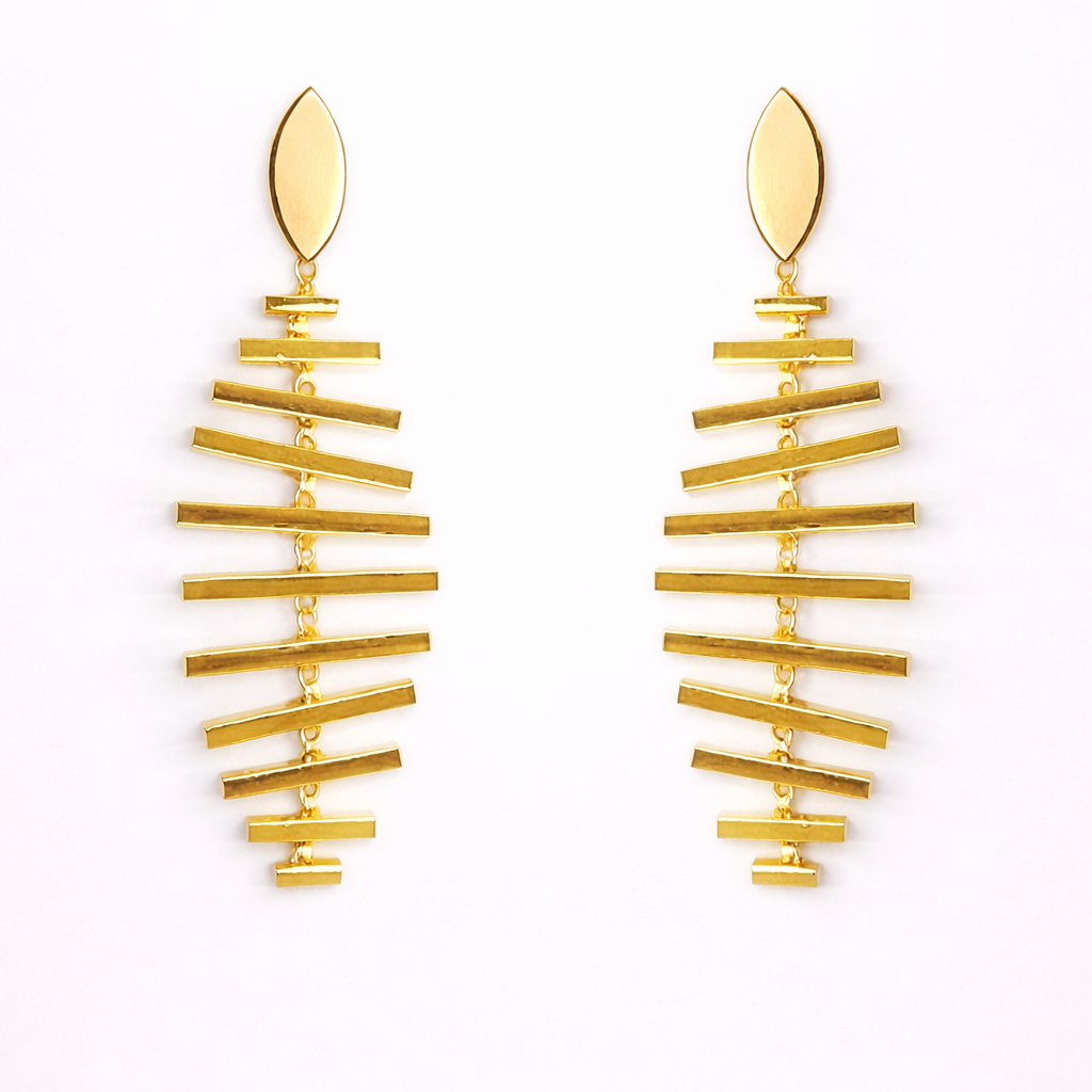 Pair of gold earrings on a white background