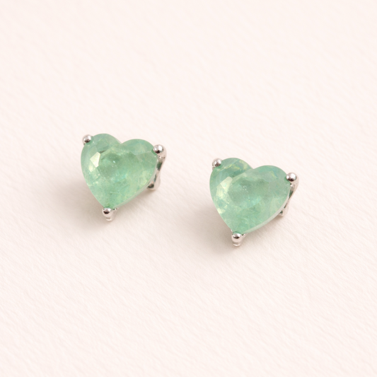 Heart-shaped mint green earrings on a white background