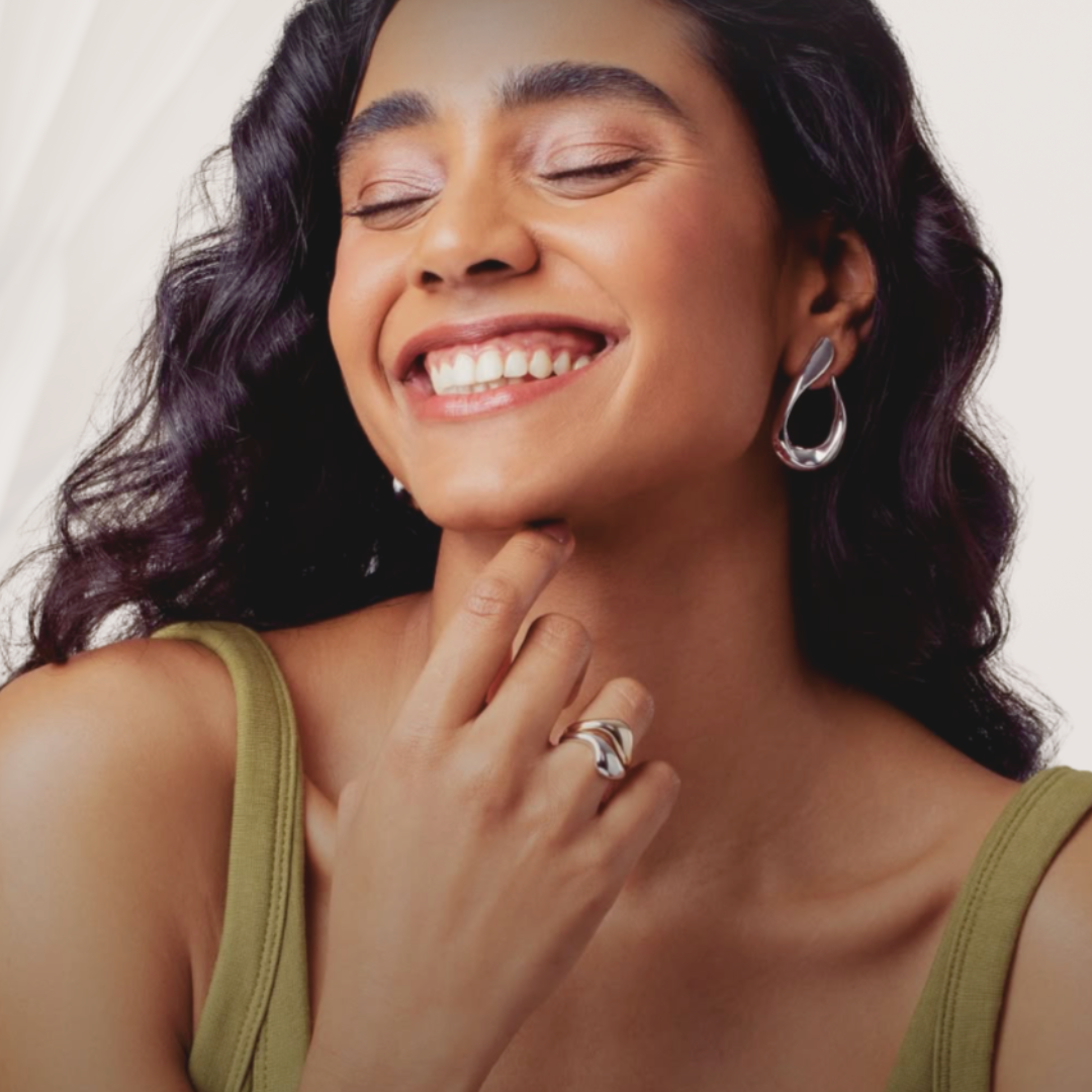 Woman wearing a ring with a white background