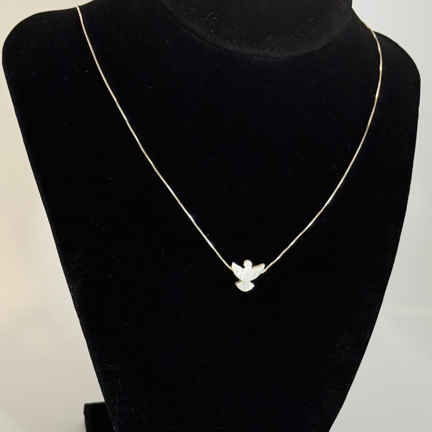 Holy Spirit Nacre Silver necklace on a white background