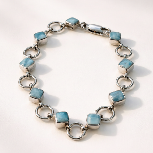 Bracelet with blue gemstones on a white background