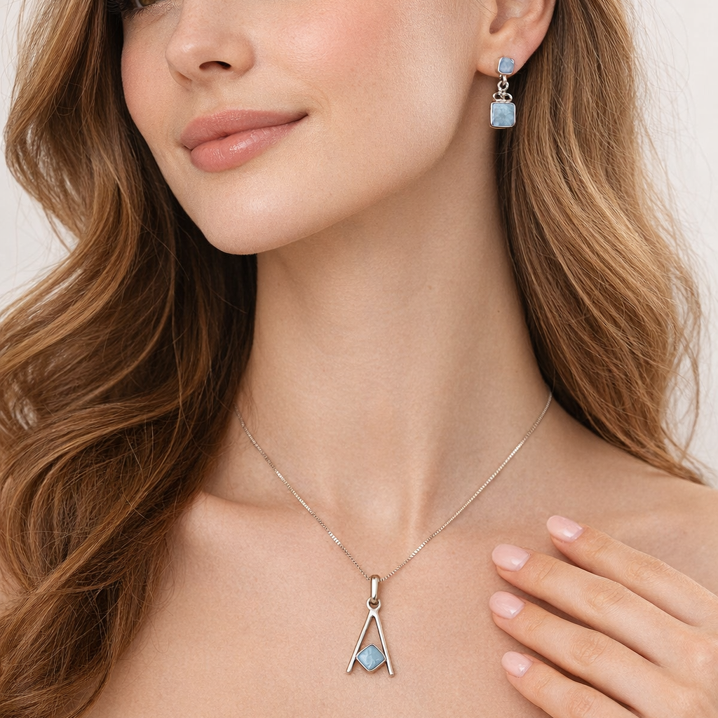Woman wearing a necklace and earrings with a white background