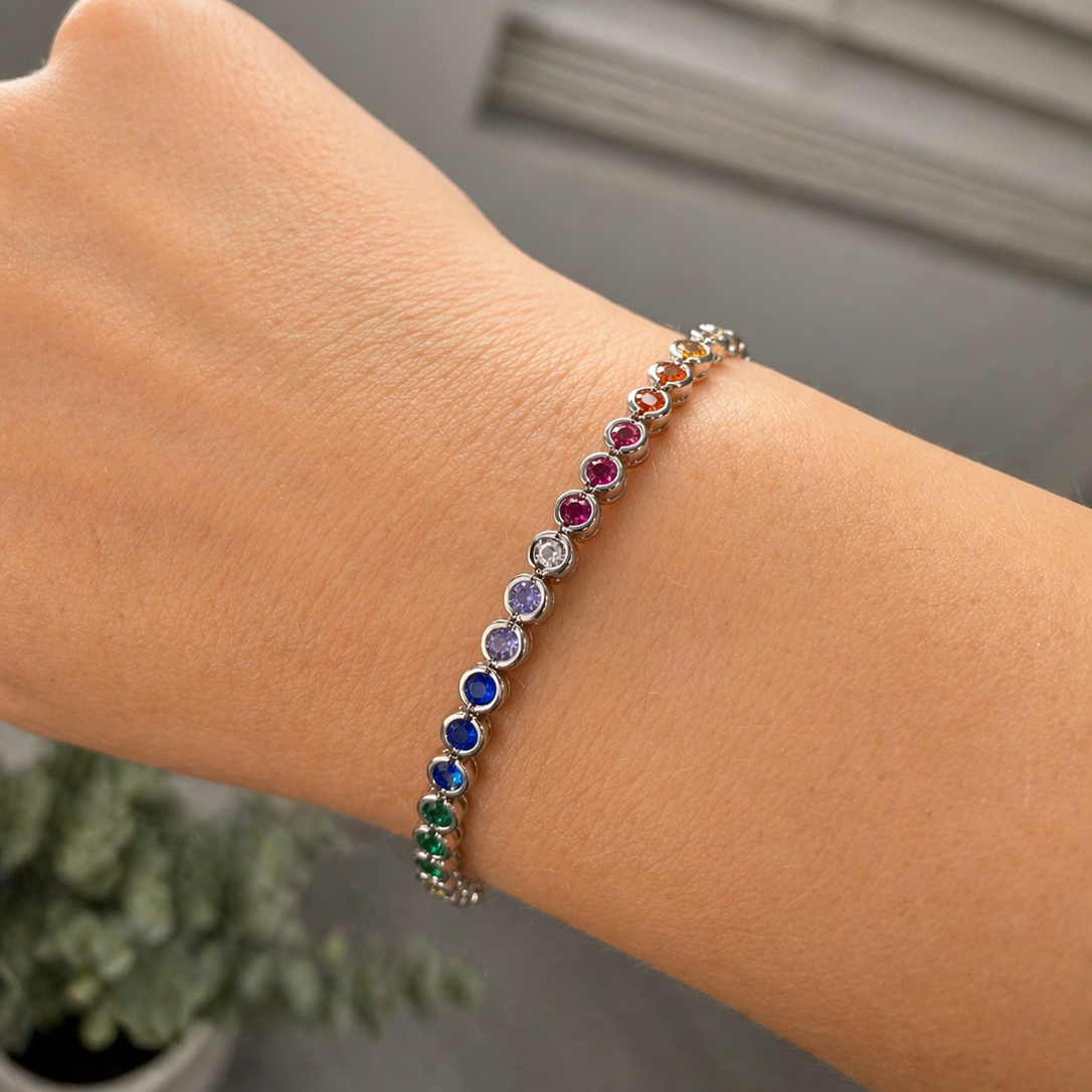 Multicolored beaded bracelet on a wrist with a blurred background