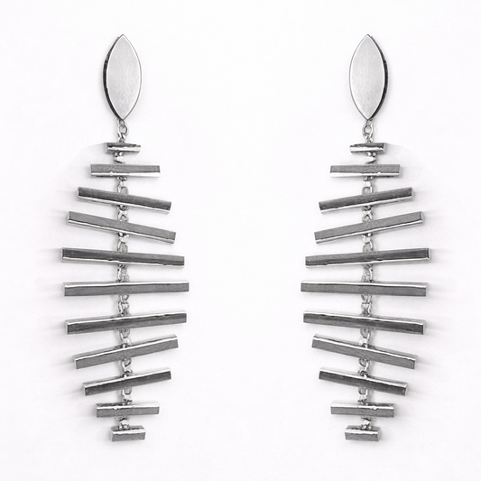 Pair of silver earrings on a white background