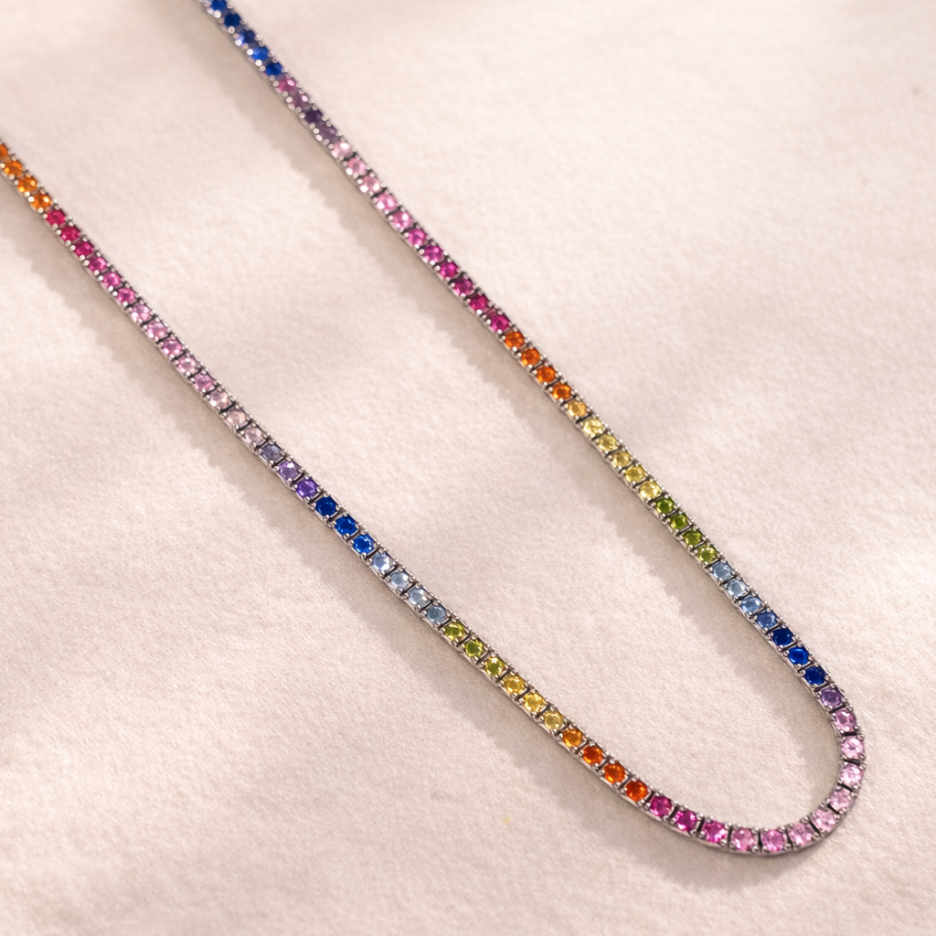 Multicolored gemstone necklace on a light background