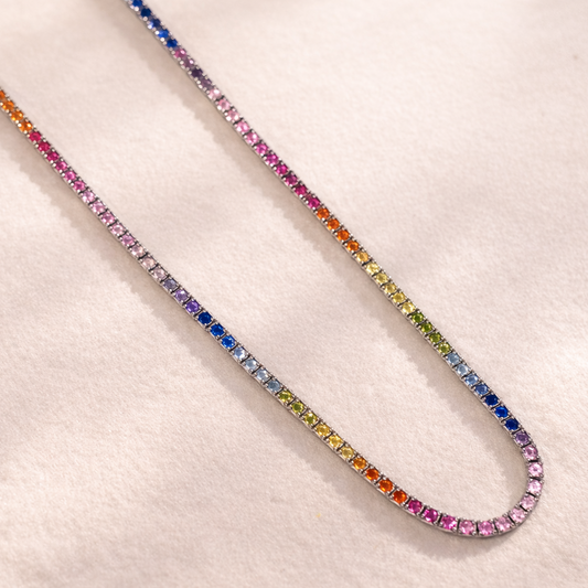Multicolored gemstone necklace on a light background