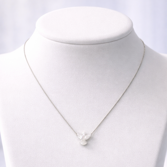 Necklace with a pendant on a mannequin bust against a white background