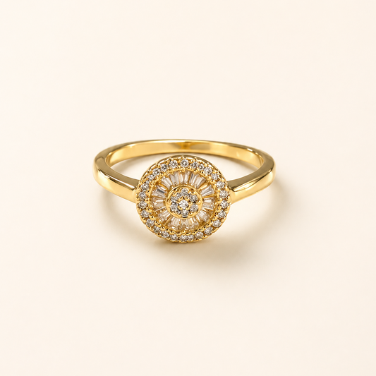 Gold ring with diamond accents on a light beige background