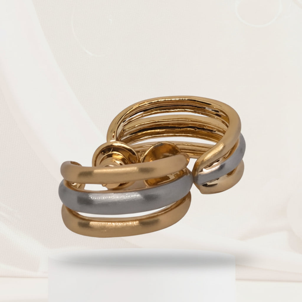 Gold and silver ring on a white background