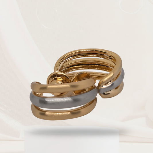 Gold and silver ring on a white background