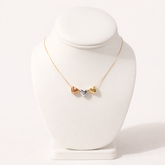 Necklace with a heart-shaped pendant on a white mannequin bust